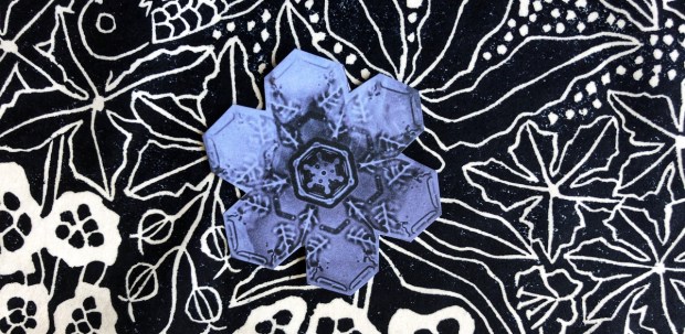 Snowflake on foliage print background
