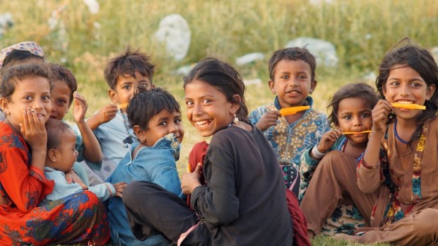 Happy Pakistani kids enjoying popsicles