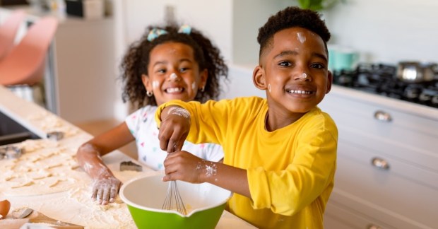 Two kids baking somewhat messy
